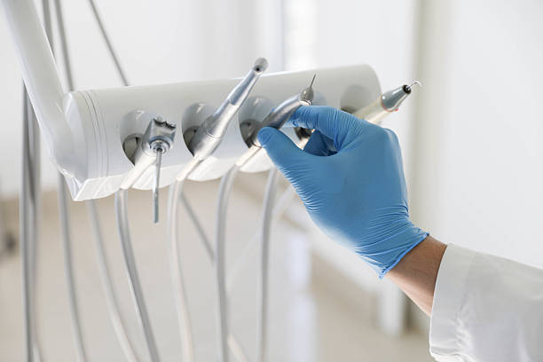 Professional Tooth Extraction technician working in Fayetteville, AR